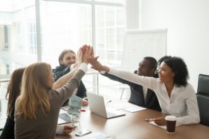 Business team meeting with hands in center