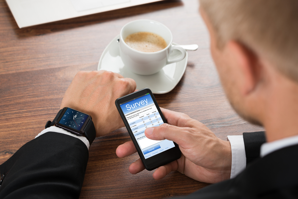 Man taking survey on phone