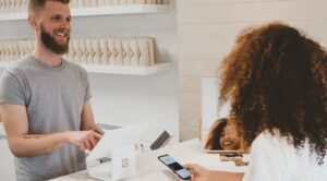 Happy customer experience at store with employee