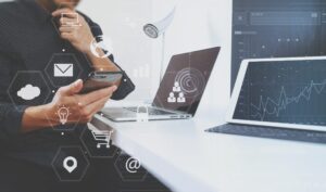 Customer with phone and laptop and data experience graphic icons