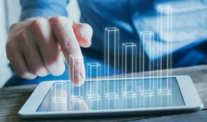 Digital analytics trend chart coming out of tablet